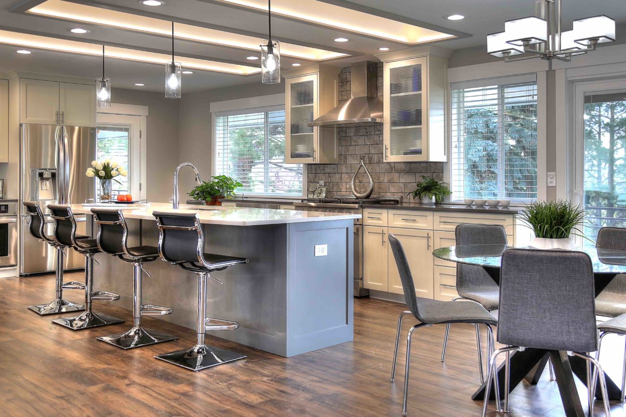 Ogden Contemporary Residential renovation, custom cabinetry, coffer ceiling, large kitchen island, white cabinetry, gray cabinetry, open concept, tile fireplace, bay window