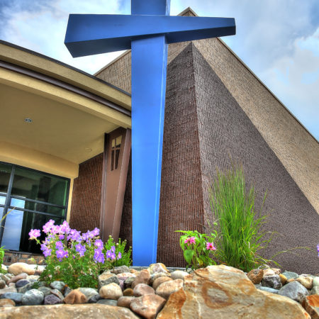 modern christian cross, horizontal exterior building lines, diagonal exterior building lines