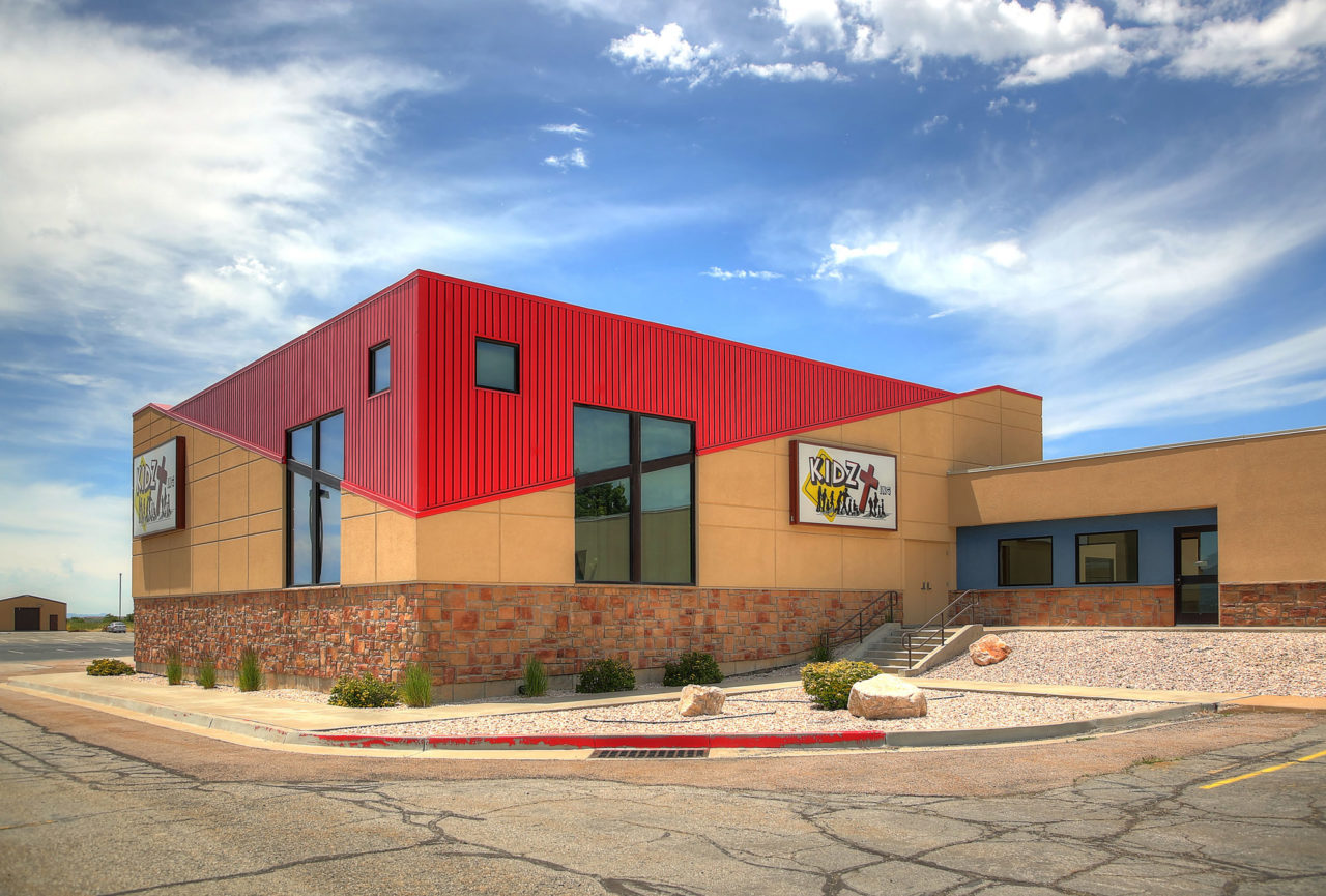 Washington Heights Addition in Ogden, UT - stucco siding with score lines - Kids zone churches - tall windows - diagonal lines in buildings