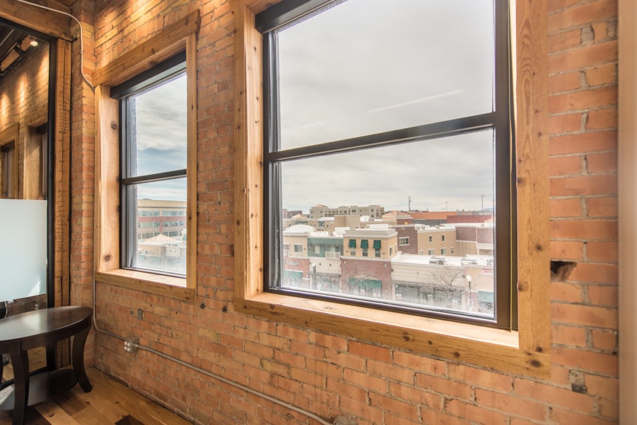 Renovated office. Glass partition walls. Family Business Center. Urban industrial design.