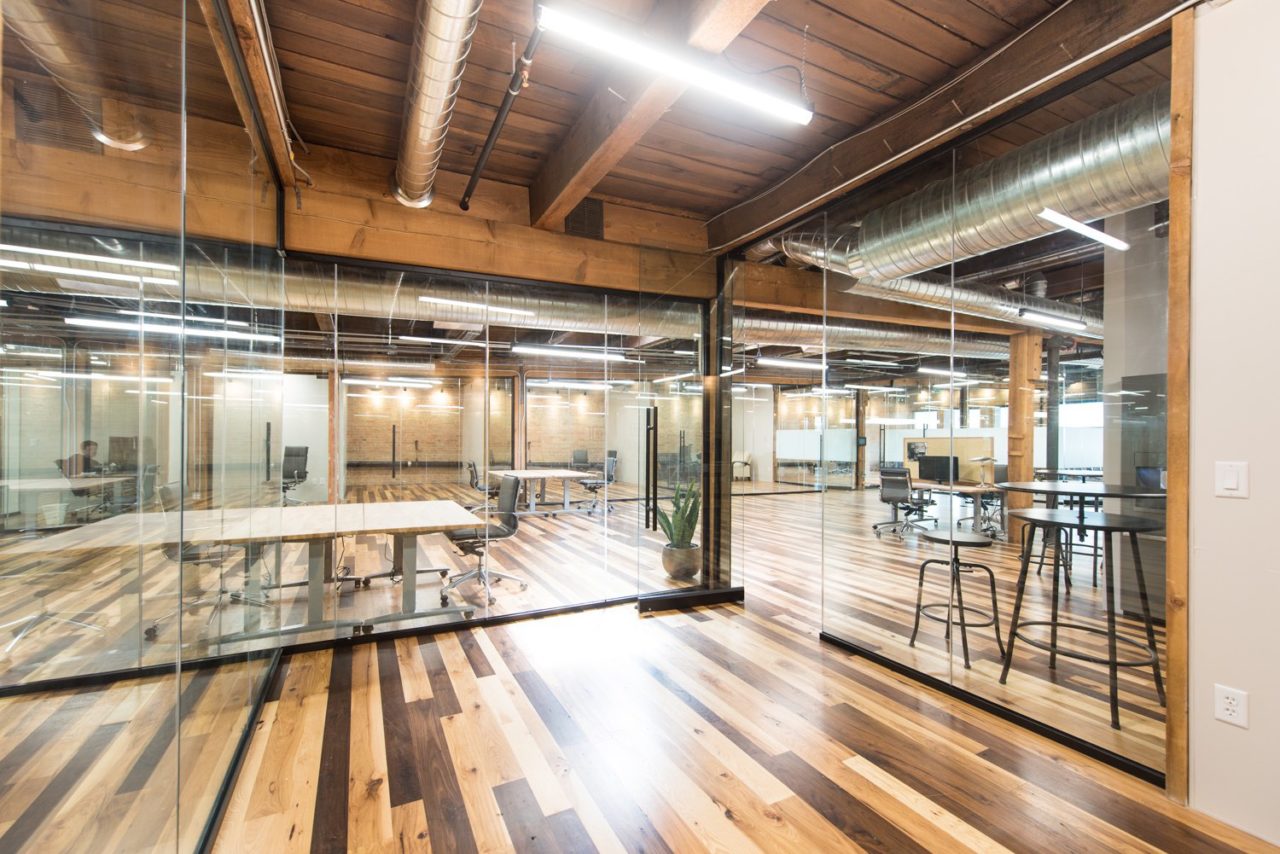 Renovated office. Glass partition walls. Family Business Center. Urban industrial design.