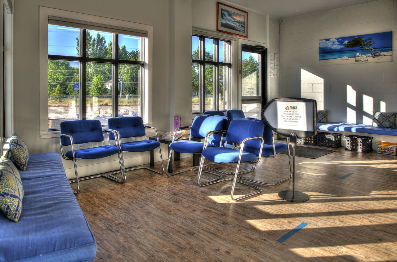 Waiting area layout, natural light, blue saeting room layout, wood finish flooring, CMU wall interior